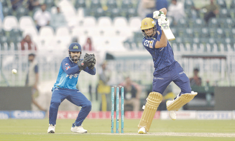 RAWALPINDI: Quetta Gladiators batter Hasan Nawaz plays a shot as Multan Sultans captain Mohammad Rizwan looks on during the Pakistan Super League match at the Rawalpindi Cricket Stadium on Sunday.—Tanveer Shahzad/White Star