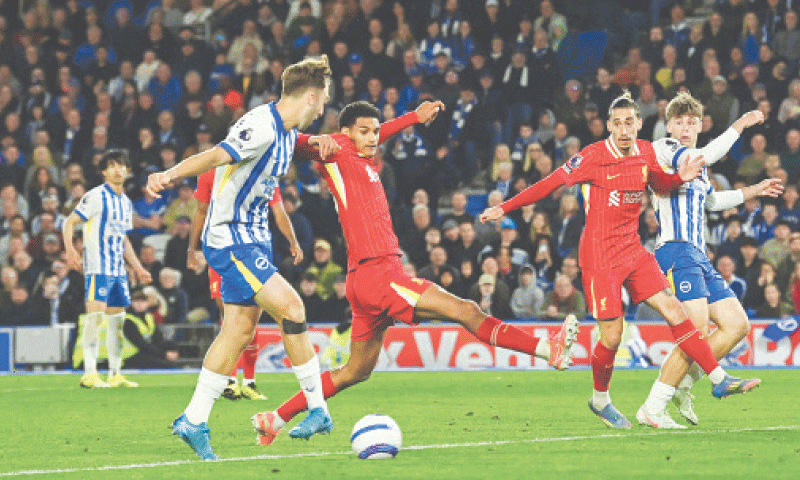 BRIGHTON and Hove Albion&rsquo;s Jack Hinshelwood (L) shoots to score against Liverpool during their Premier League match at the American Express Community Stadium.&mdash;AFP