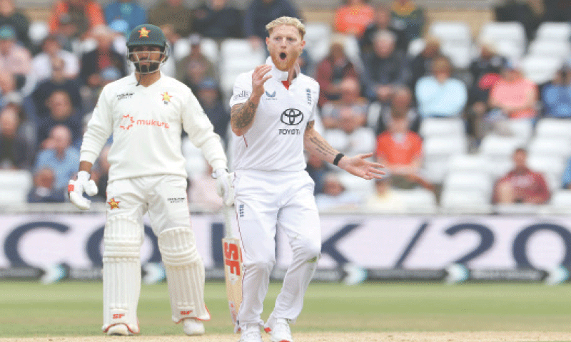England captain Ben Stokes reacts after seeing team-mate Harry Brook take a stunning catch to dismiss Zimbabwe&rsquo;s Wessly Madhevere during the four-day Test at Trent Bridge on Saturday.&mdash;AFP