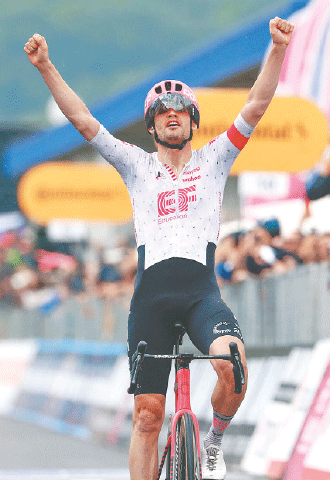 NOVA GORICA: EF Education-EasyPost’s Danish rider Kasper Asgreen celebrates after crossing the finish line to win the 14th stage of the Giro d’Italia on Saturday.—AFP