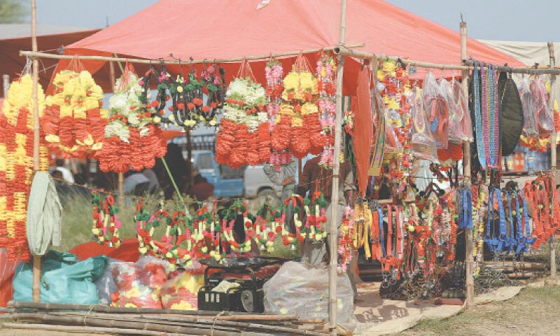 Handmade decorative items and accessories on display at a stall in the market.