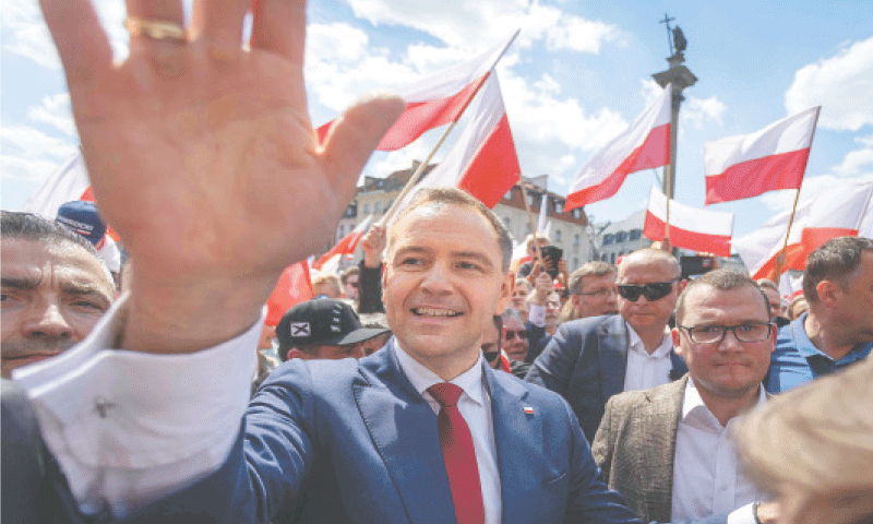 POLAND&rsquo;s presidential candidate Karol Nawrocki (centre) attends a rally in Warsaw on Sunday, a week ahead of the second round of presidential elections.&mdash;AFP