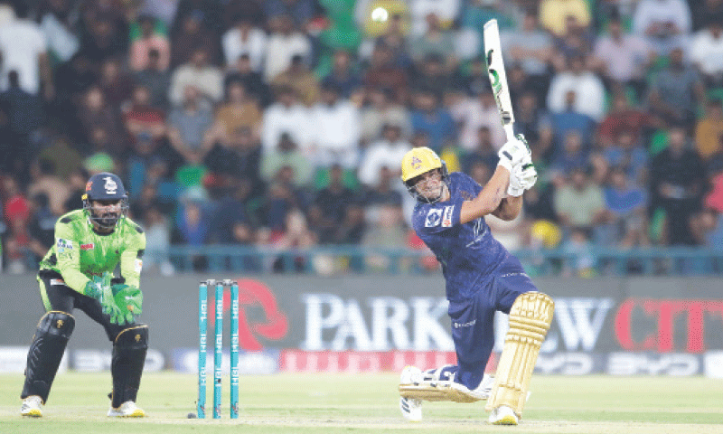 QUETTA Gladiators batter Hasan Nawaz plays a lofted shot as Lahore Qalandars wicket-keeper Kusal Perera looks on during the Pakistan Super League final at the Gaddafi Stadium on Sunday.&mdash;M. Arif/White Star