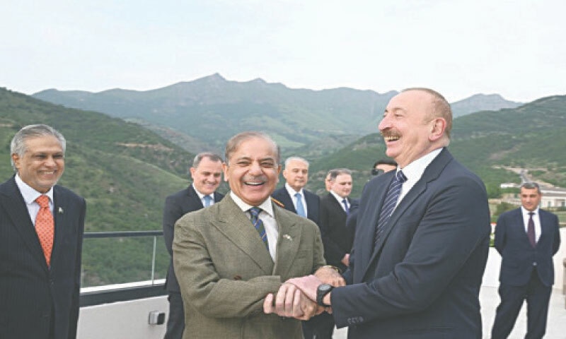 LACHIN: Prime Minister Shehbaz Sharif shares a light moment with Azerbaijan President Ilham Aliyev on Tuesday.&mdash;Courtesy PM Office