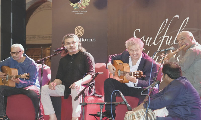 Portuguese classical guitarist Pedro Joia and musician Arieb Azhar perform at a concert titled Soulful Strings: Portugal and Pakistan in Islamabad on Wednesday. &mdash; Photo by Tanveer Shahzad