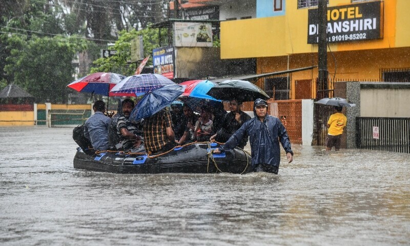 Members of National Disaster Response Force (NDRF) team evacuate patients, attendants and medical staff from the flood-affected Jawaharlal Nehru Institute of Medical Sciences hospital, following heavy rains in Imphal East, Manipur, India June 1. — Reuters