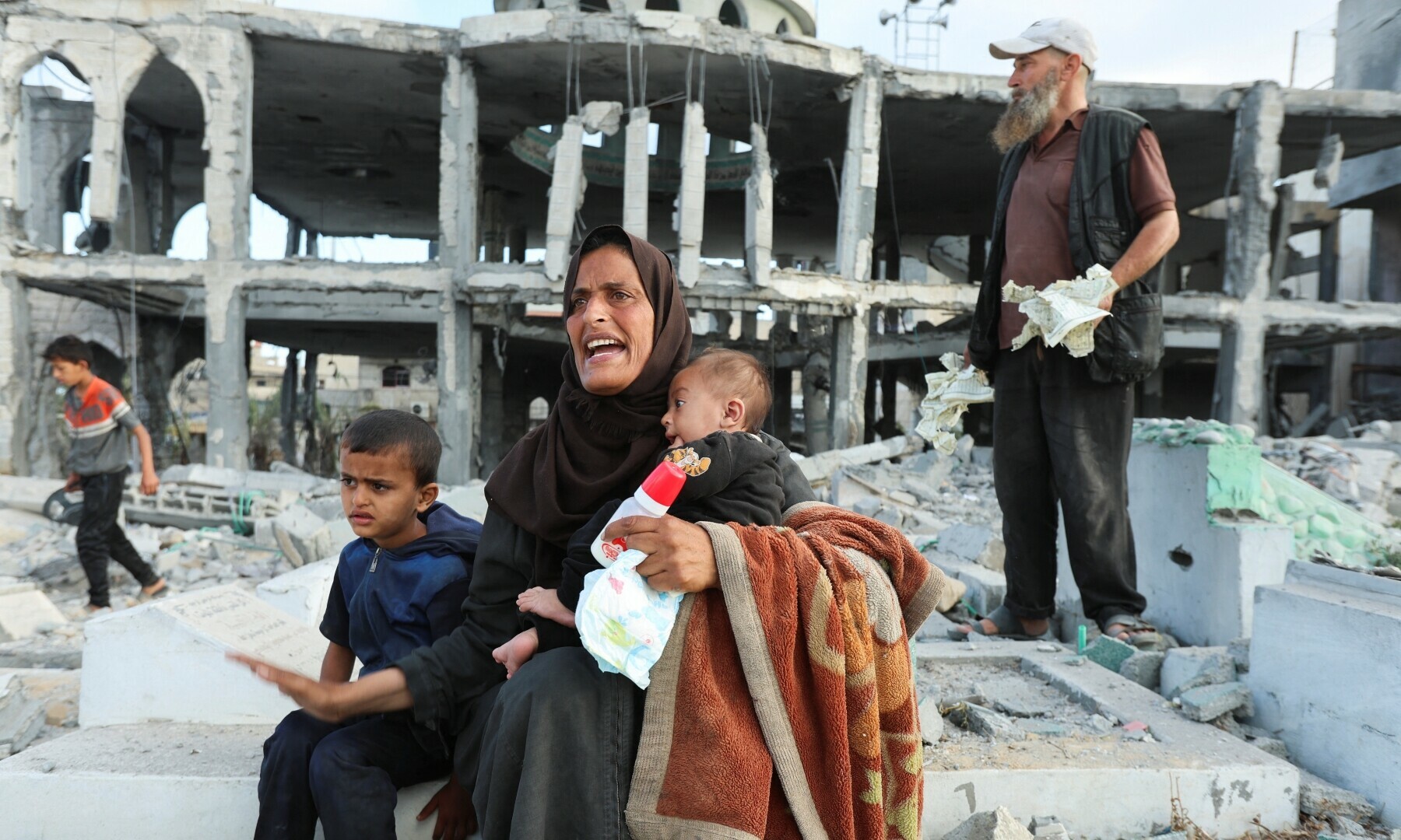 Palestinians react at the site of an Israeli strike on a mosque in Deir Al-Balah in the central Gaza Strip on June 2, 2025. — Reuters/Ramadan Abed