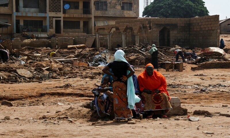 People are seen near their collapsed houses following a flooding that killed over 200 people and forced several thousand from their homes in Mokwa, Niger State, Nigeria, May 31, 2025. &mdash; Reuters/File