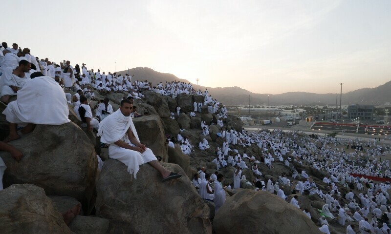  Muslim pilgrims pray at dawn on Saudi Arabia’s Mount Arafat, also known as Jabal al-Rahma or Mount of Mercy, during the climax of the Haj pilgrimage on June 5. — AFP 