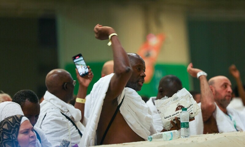 Pilgrims perform the symbolic ‘stoning of the devil’ ritual as part of the Haj pilgrimage in Mina on June 6. — AFP