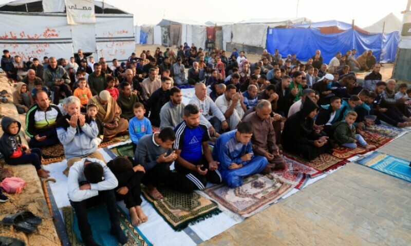 Palestinian men and boys perform Eidul Azha prayers in Khan Younis, in the southern Gaza Strip, June 6, 2025. &mdash; Reuters