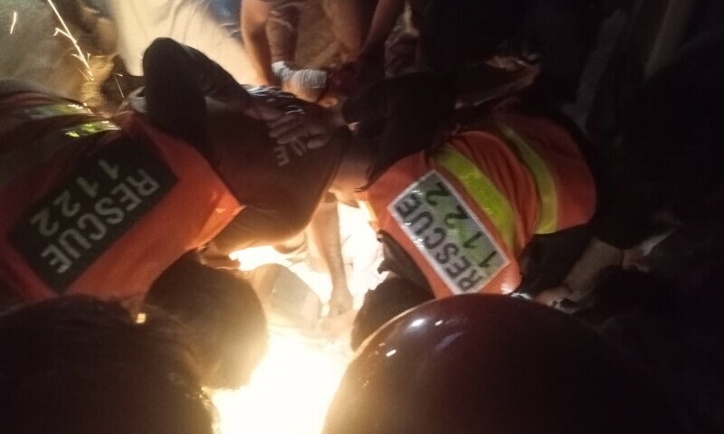 Rescue 1122 teams search people under the rubble following a cylinder explosion in Mardan. — Photo by the author