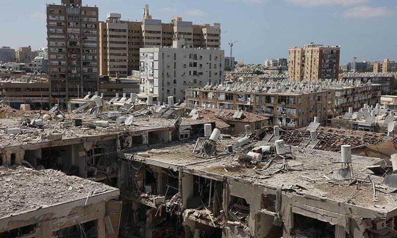 A general view shows heavily damaged buildings, following an overnight Iranian missile strike in Bat Yam on June 15, 2025. Israeli Prime Minister Benjamin Netanyahu said that Iran would pay “a very heavy price” for killing Israeli civilians, during a June 15 visit to the site of a missile strike on a residential building near Tel Aviv, as the two foes kept up intense fighting. (Photo by GIL COHEN-MAGEN / AFP)