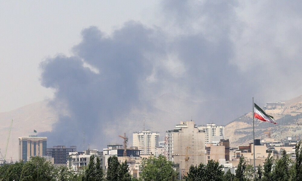 Smoke billows for the second day from the Shahran oil depot, northwest of Tehran, on June 16, 2025. Iran unleashed a barrage of missile strikes on Israeli cities early on June 16, after Israel struck military targets deep inside Iran, with both sides threatening further devastation. (Photo by ATTA KENARE / AFP)