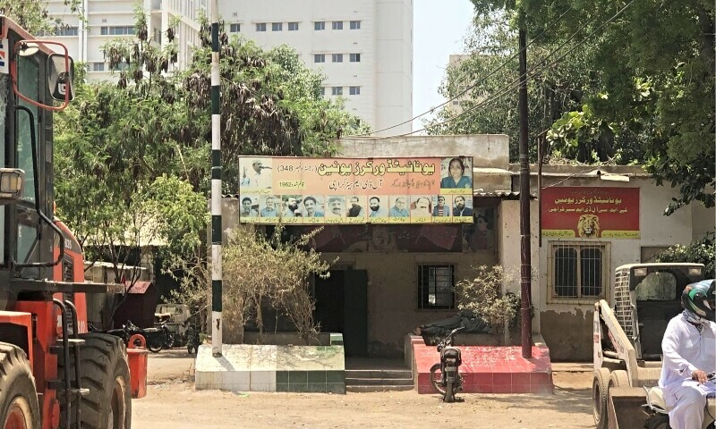A view of the KMC workshop showing one of the workers sleeping on the ledge. — Zil E Huma