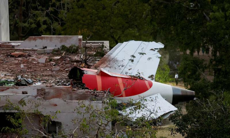 Tail of an Air India Boeing 787 Dreamliner plane that crashed is seen stuck on a building after the incident in Ahmedabad, India, June 12, 2025. — Reuters