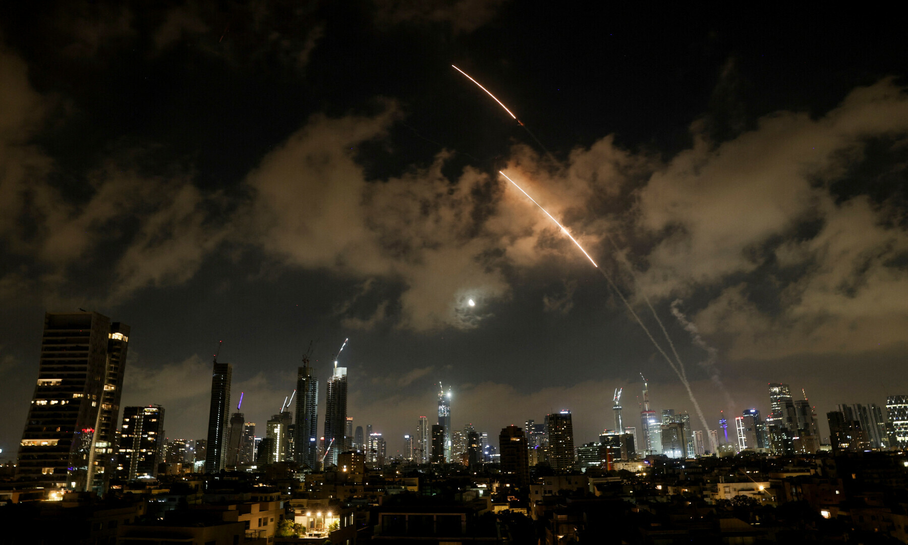 An anti-missile system operates as missiles are launched from Iran, as seen from Tel Aviv, Israel on June 18, 2025. — Reuters/Violeta Santos Moura
