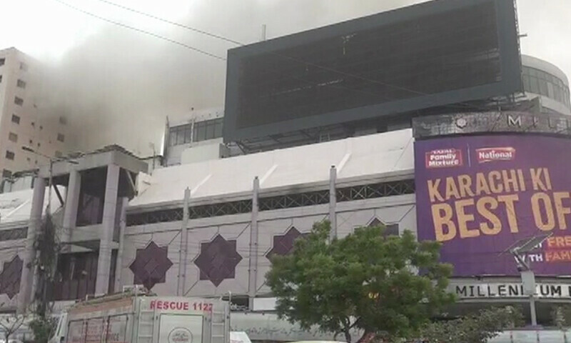 Smoke billows from Millennium Mall in Karachi after firefighter doused a blaze there on June 18.—DawnNewsTV