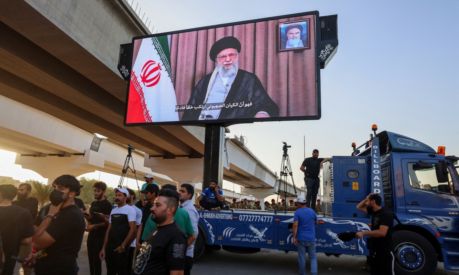 Supporters of Iraqi pro-Iran groups wheel a screen displaying Iran’s supreme leader, Ayatollah Ali Khamenei during a protest in Baghdad near the green zone, the ultra secured neighbourhood hosting the US embassy, on June 16, 2025, amid the Israel-Iran escalating conflict. — AFP