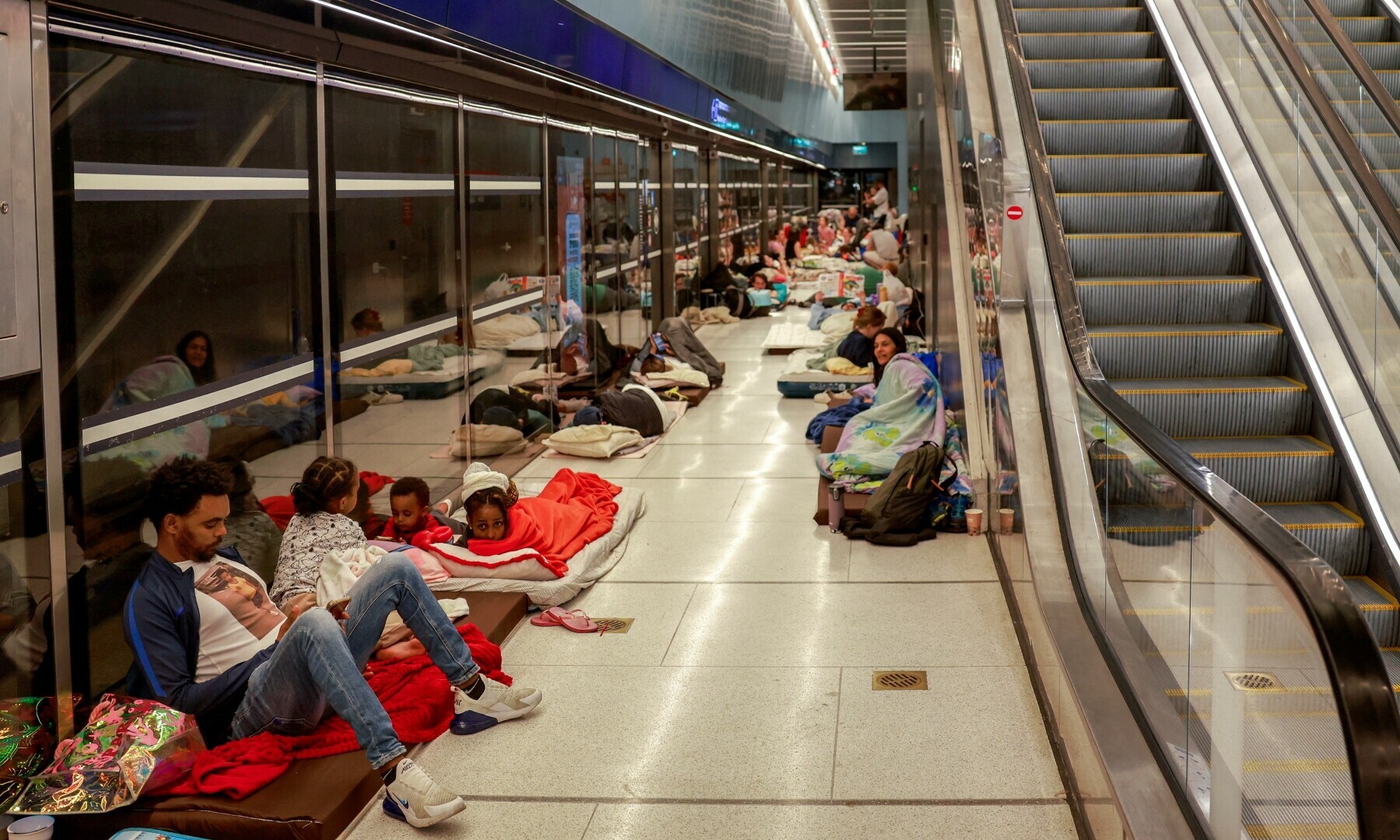 People take shelter for the night at an underground light rail station in the city of Ramat Gan, east of Tel Aviv, on June 17, 2025 amidst fears of an Iranian missile attack. — AFP