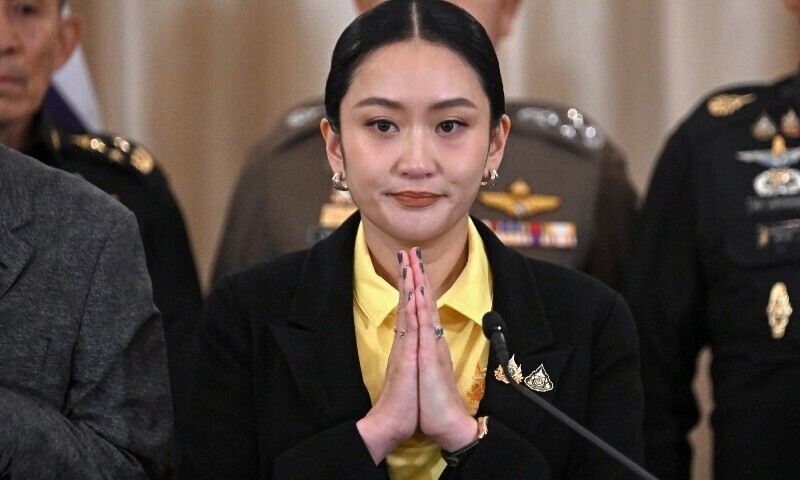 Thailand’s Prime Minister Paetongtarn Shinawatra (C) gestures during a press conference surrounded by senior Thai army commanders and government ministers at Government House in Bangkok on June 19. — AFP
