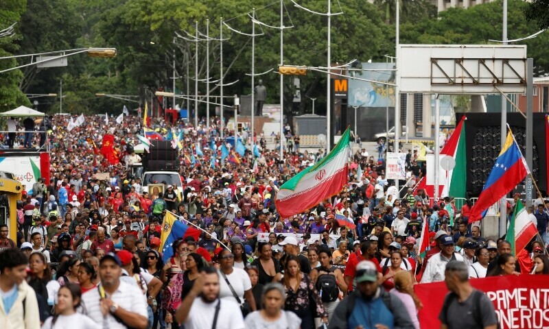  Venezuelan government supporters participate in a march in support of Iran, amid the ongoing conflict between Israel and Iran, in Caracas, Venezuela on June 19, 2025. &mdash; Reuters 