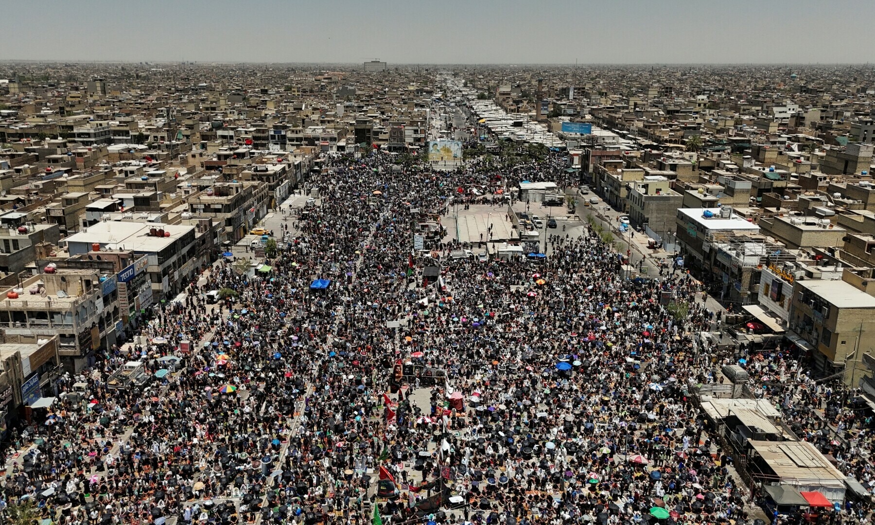  A drone view shows supporters of Iraqi Shia cleric Moqtada al-Sadr attending Friday prayers to protest against repeated violations of Iraqi airspace and to denounce attacks on Iran, amid the Iran-Israel conflict, in Baghdad, Iraq on June 20, 2025. &mdash; Reuters/Thaier Al-Sudani 
