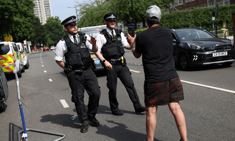  A protester speaks with police as they dismantle their protest, after six men were arrested earlier on the same day on suspicion of grievous bodily harm, near Iran&rsquo;s embassy, London, Britain on June 20, 2025. &mdash; Reuters/Isabel Infantes 