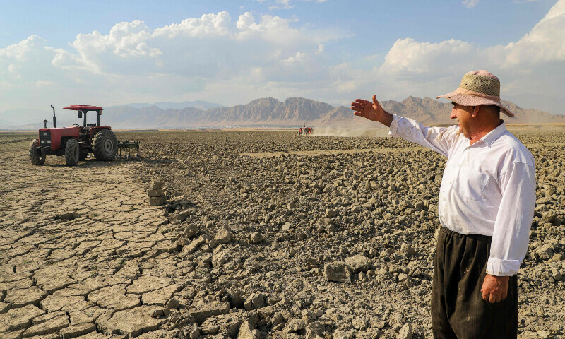 Hussein Khedr Shekha, a 57-year-old farmer, gestures as he speaks by a field near the village of Sarsian, at the edge of the Dukan dam reservoir northwest of Iraq’s northeastern city of Sulaimaniyah in the autonomous Kurdistan region are pictured on June 4, 2025. — AFP