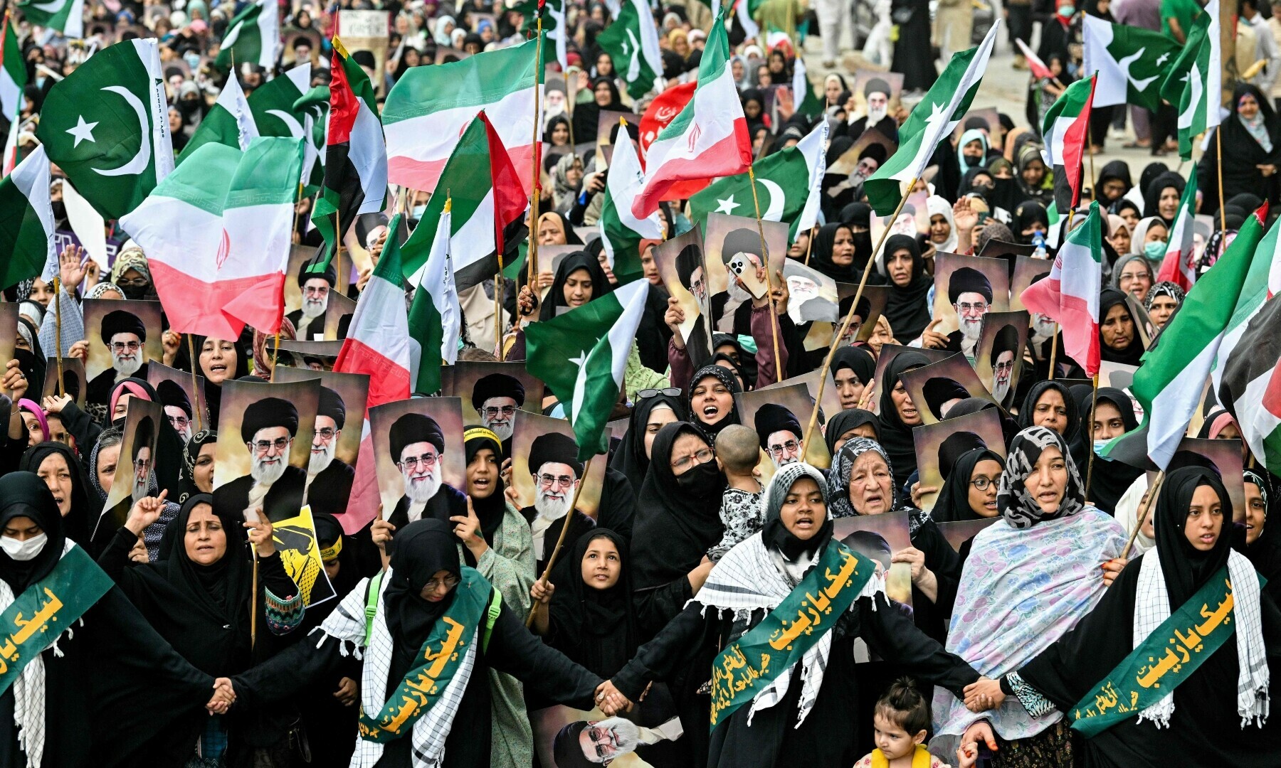  Protesters hold portraits of Iran&rsquo;s Supreme Leader Ayatollah Ali Khamenei to condemn US and Israel&rsquo;s attacks on Iran, during a protest in Karachi on June 22, 2025. &mdash; AFP 