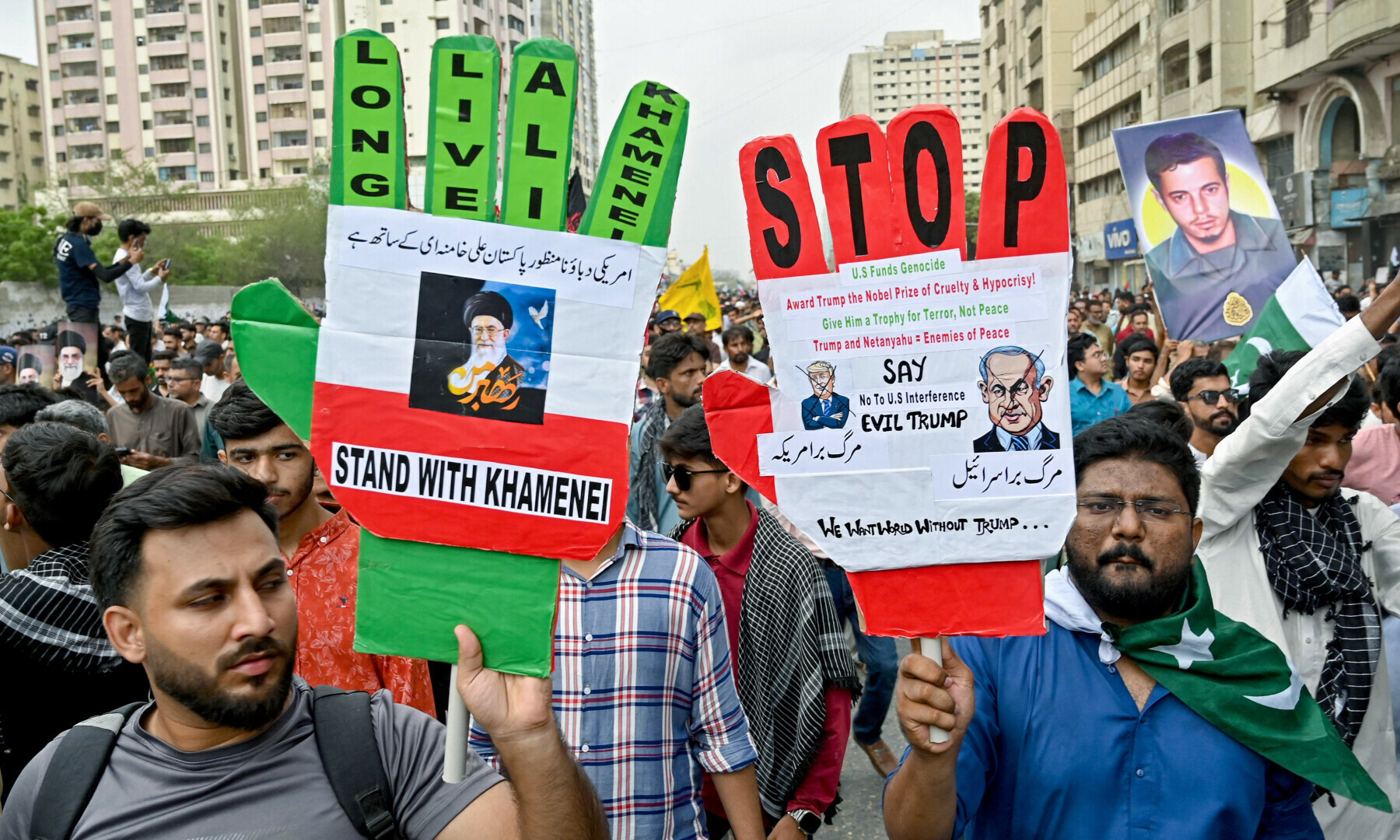  Protesters hold placards to condemn US and Israel&rsquo;s attacks on Iran, during a protest in Karachi on June 22, 2025. &mdash; AFP 