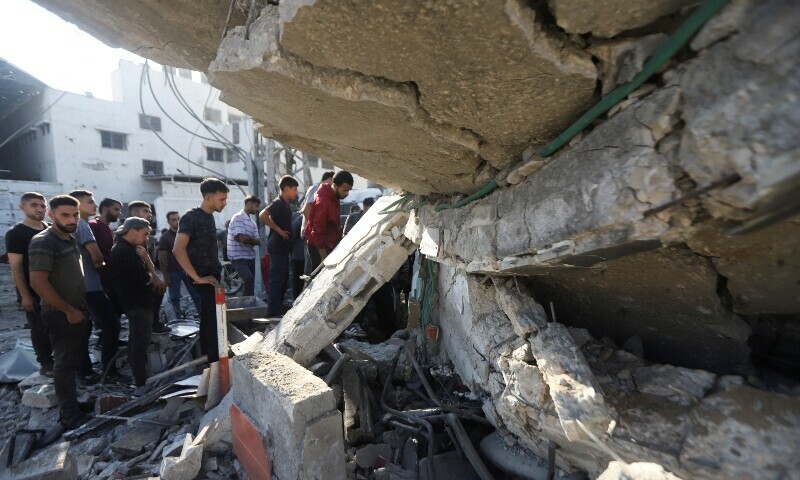 Palestinians search for casualties at the site of an overnight Israeli strike on a fuel station where displaced people shelter, in Gaza City, June 25, 2025. — Reuters