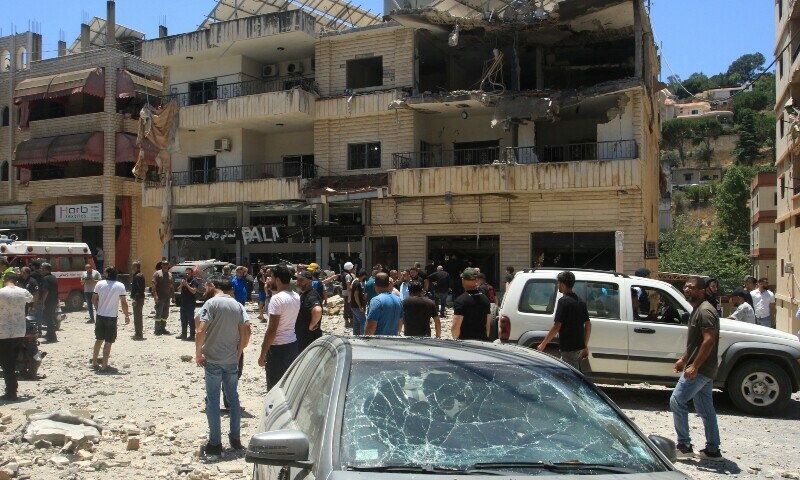 People inspect the damage after an Israeli strike on Nabatieh in southern Lebanon on June 27. &mdash; AFP