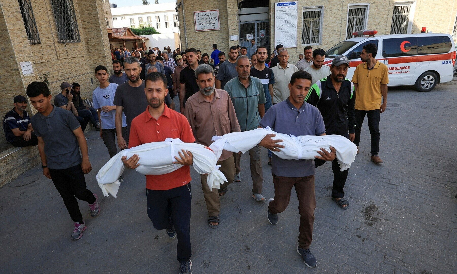Mourners carry the bodies of Palestinian children killed in an Israeli strike on a house late at night, according to Gaza&rsquo;s health ministry, during the funeral at Al-Ahli Arab Hospital in Gaza City, June 29. &mdash; Reuters