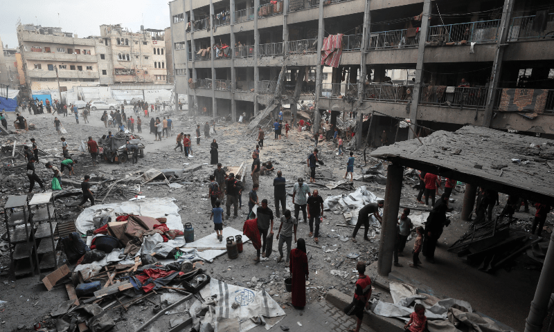 Palestinians inspect the damage at an UNRWA school sheltering displaced people that was hit in an Israeli air strike on Sunday, in Gaza City on June 30, 2025. &mdash; Reuters