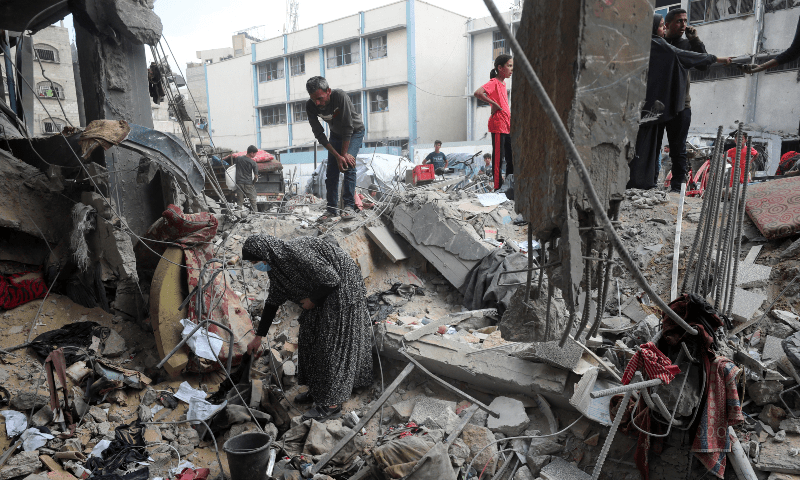 Palestinians inspect the damage at an UNRWA school sheltering displaced people that was hit in an Israeli air strike on Sunday, in Gaza City on June 30, 2025. &mdash; Reuters