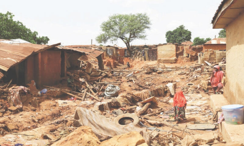 Mokwa (Nigeria): Rubble from collapsed houses is seen after floods forced several thousand people from their homes on Saturday.&mdash;Reuters