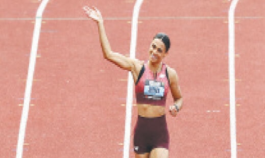 Sydney McLaughlin-Levrone of the US waves to fans after competing in the women&rsquo;s 100m event during the Grand Slam Track at Franklin Field of the University of Pennsylvania.&mdash;AFP