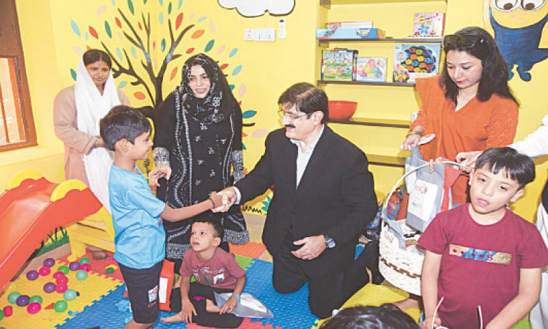 CM Murad Ali Shah interacts with a child at the Centre for Rehabilitation of Children with Physical and Neurodevelopmental Disabilities.&mdash;Dawn