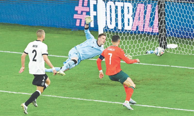 PORTUGAL&rsquo;S Cristiano Ronaldo scores the winner past Germany goalkeeper Marc-Andre ter Stegen during their Nations League semi-final at the Allianz Arena.&mdash;Reuters
