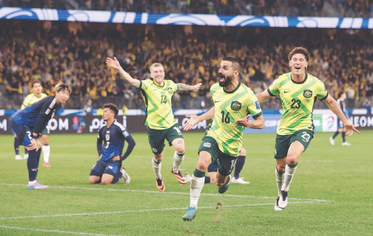 AUSTRALIA&rsquo;S Aziz Behich (second R) celebrates after scoring against Japan during their World Cup qualification match at the Perth Stadium on Thursday.&mdash;Reuters