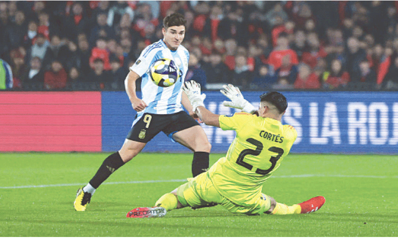 SANTIAGO: Argentina’s Julian Alvarez scores past Chile goalkeeper Brayan Cortes during their 2026 World Cup qualifier at Estadio Nacional Julio Martinez Pradanos.—Reuters
