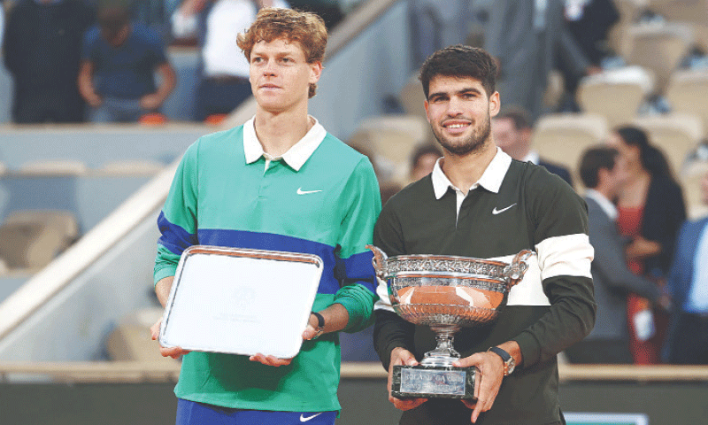 Spain&rsquo;s Carlos Alcaraz (R) and Jannik Sinner of Italy pose with their respective winner and runner-up trophies after the French Open final at the Roland Garros Complex.&mdash;AFP