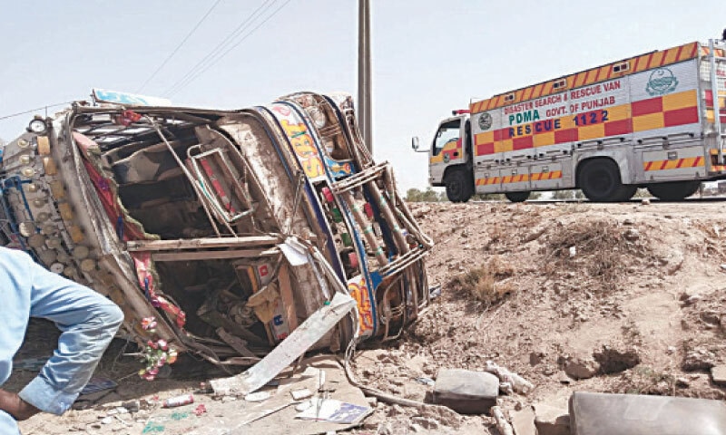 TOBA TEK SINGH: A bus overturns due to speeding on Faisalabad-Jhang Road. — Dawn