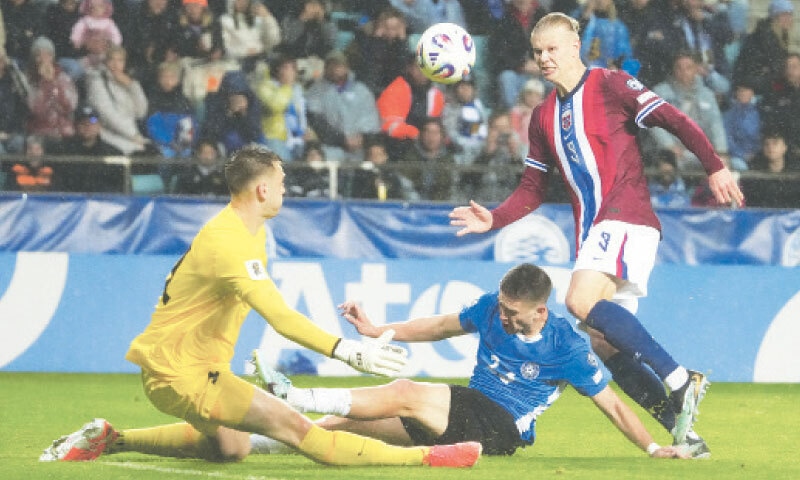 TALLINN (Estonia): Norway&rsquo;s Erling Haaland (R) scores past Estonia goalkeeper Karl Hein during their World Cup qualifying match at the A. Le Coq Arena.&mdash;Reuters