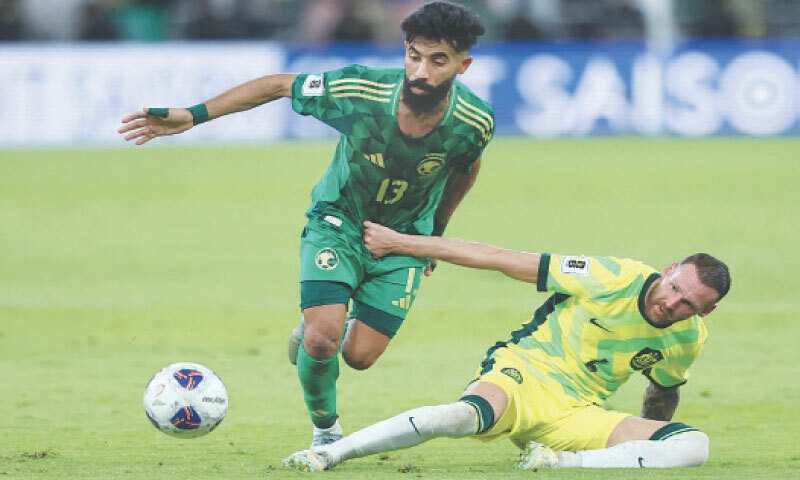 JEDDAH: Saudi Arabia&rsquo;s Nawaf Boushal is tackled by Martin Boyle of Australia during their World Cup qualifier at the King Abdullah Sport City.&mdash;AFP