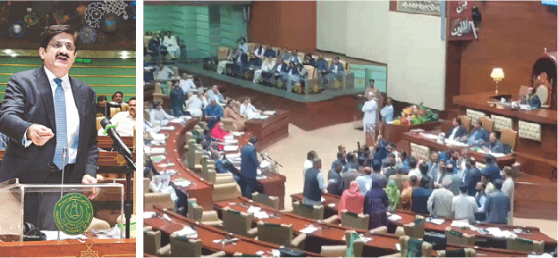 Chief Minister of Sindh Murad Ali Shah delivers the budget speech as opposition members (right) gather in front of the speaker’s dais to stage a protest.—APP / PPI