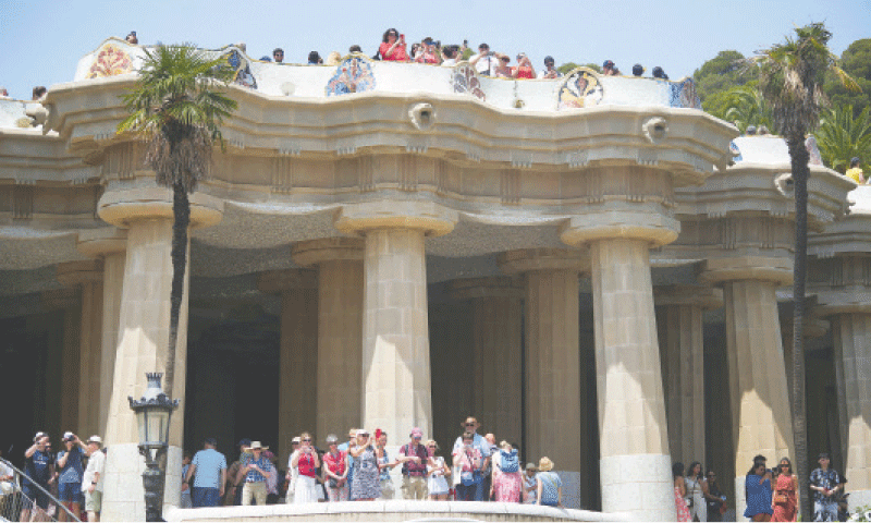 Tourists visit Park Guell in Barcelona while anti-tourism activists across southern Europe team up to pressure authorities to act against overcrowding of cities.—Reuters