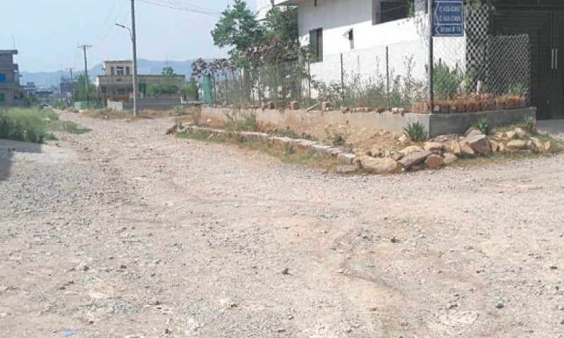 The Roshan Pakistan housing society lacks basic amenities, including paved streets. — White Star