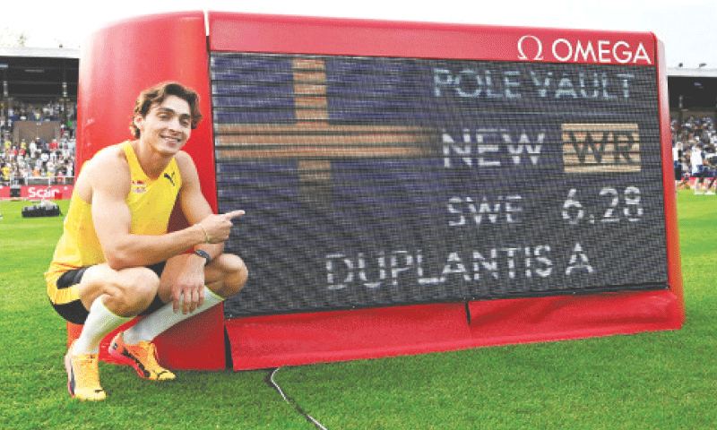 SWEDEN’S Armand Duplantis poses after setting a new pole vault world record at the Stockholm Olympic Stadium.—Reuters